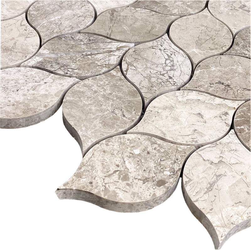 https://villohome.com/cdn/shop/products/Silver-shadow-marble-mosaic-tile-leaf-design-on-12x12-mesh-honed-profile-view_800x.jpg?v=1655814563