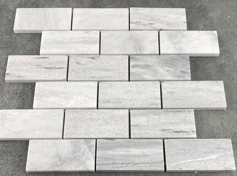 Solto white marble mosaic tile 2x4 brick on 12x12 mesh honed top view