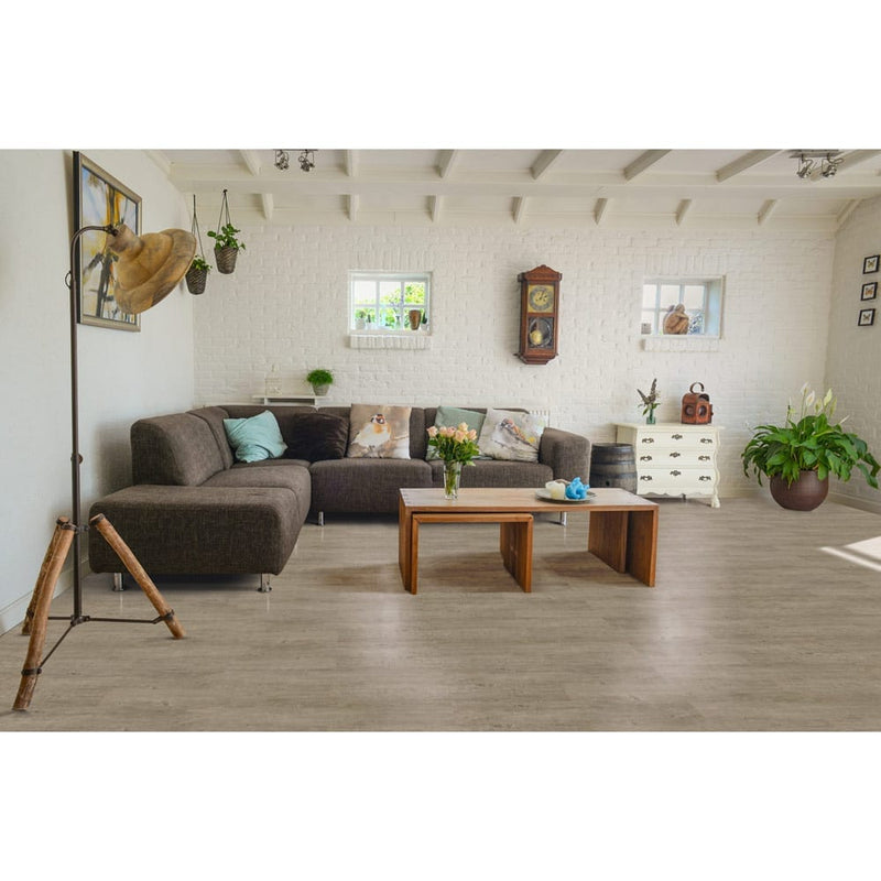 Sterling oak rigid core luxury vinyl plank flooring 7x48 SPC42110748-22M installed on living room floor
