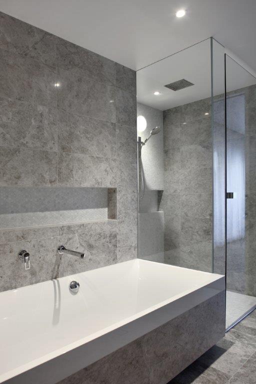 Tundra gray marble floor wall tile 24x24 polished installed on bathroom wall and floor
