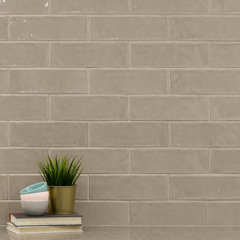 Urbano warm concrete ceramic gray subway tile 4x12 glossy  NURBWARCON4X12 room shot table view
