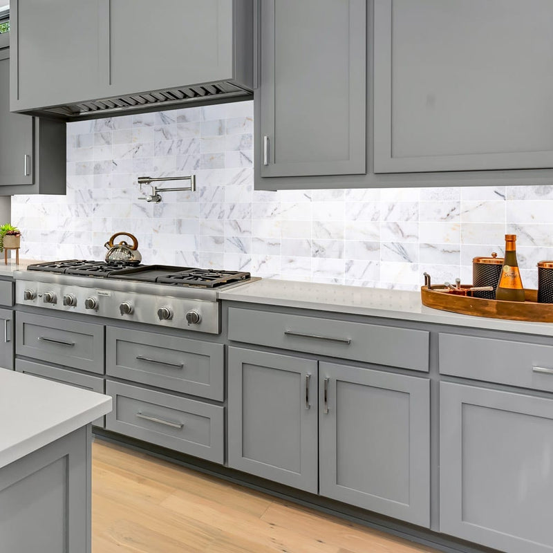 bianco ibiza white marble tile 3x6 backsplash polished BIBWMZ3x6P installed to a modern kitchen wall closeup