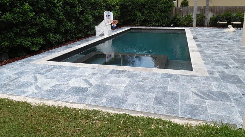 bluestone marble pavers patio outdoor pattern installed around pool wide view
