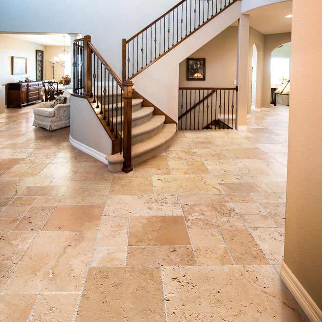 classic beige travertine tiles antique pattern brushed chiseled CBLTAPBFCE installed to a foyer of a house floor closeup