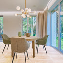 classic light vein cut travertine tile 12x24 honed filled installed to living room floor with green chairs