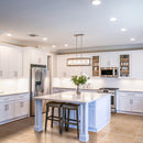 classic light vein cut travertine tile 12x24 polished installed to kitchen floor white cabinets