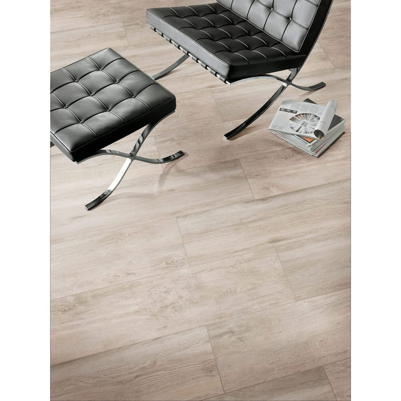 lucas canitia porcelain pavers 12x48in matte floor tile LPAVNLUCCAN1248 installed on floor black chair and magazines