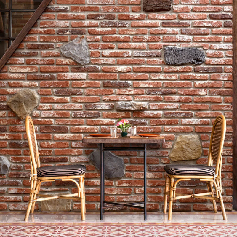 manufactured stone brick veneer ferrara nostalgia handmade B02NO 318804 installed on cafe exterior wall wooden table bamboo chairs