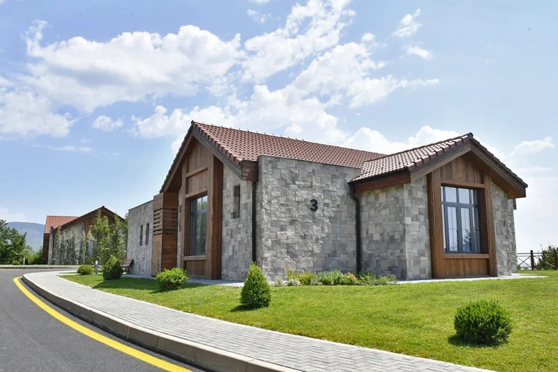 manufactured stone veneer ashlar pattern petra olive handmade S11OL 101241 installed facade house wide