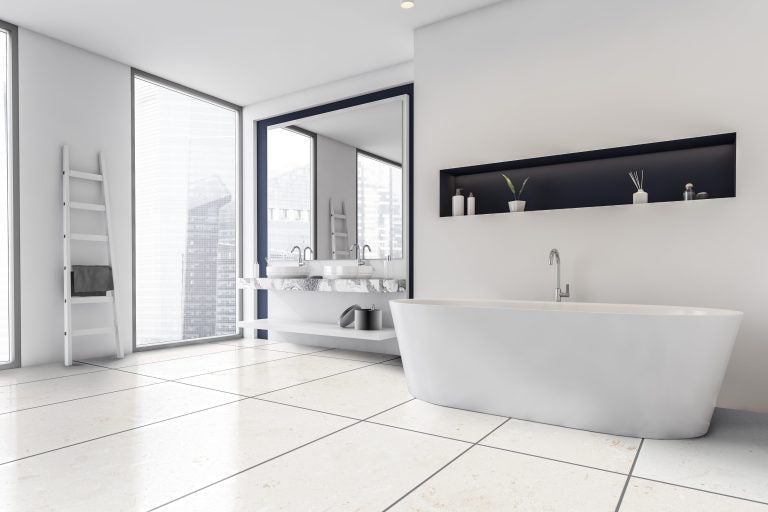 mayra white limestone 24x48 honed installed on modern bathroom floor