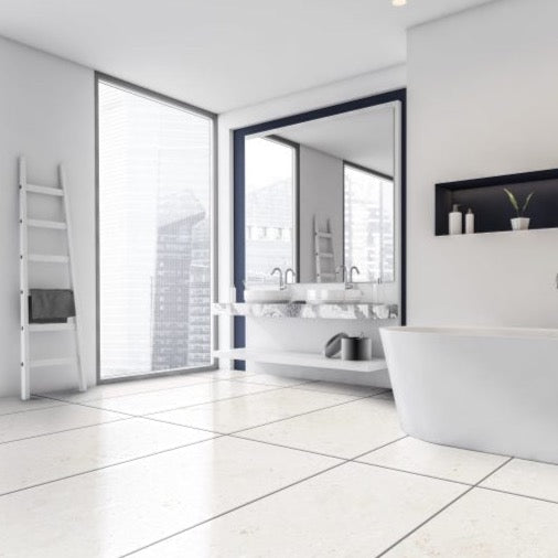 mayra white limestone 24x48 brushed installed on modern bathroom floor