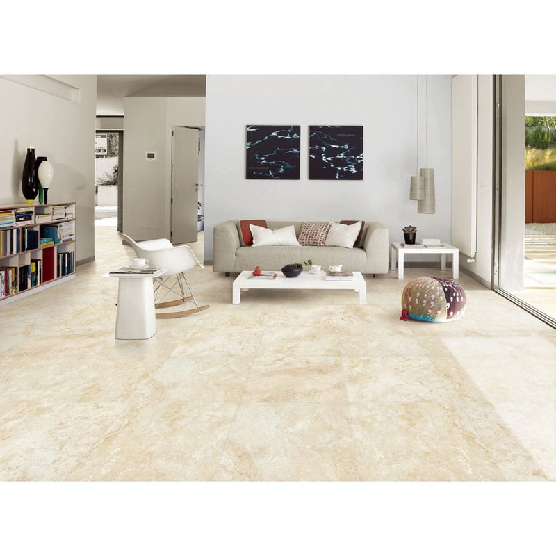 tierra ivory travertine look porcelain pavers 24x24in matte floor tile LPAVNTIEIVO2424 installed on a living room floor where there is grey seating set