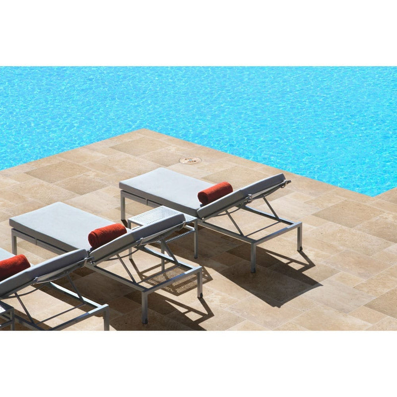 tuscany beige travertine pavers pattern tumbled floor tile LPAVTBEI10KITS installed around swimming pool with 3 sun-beds